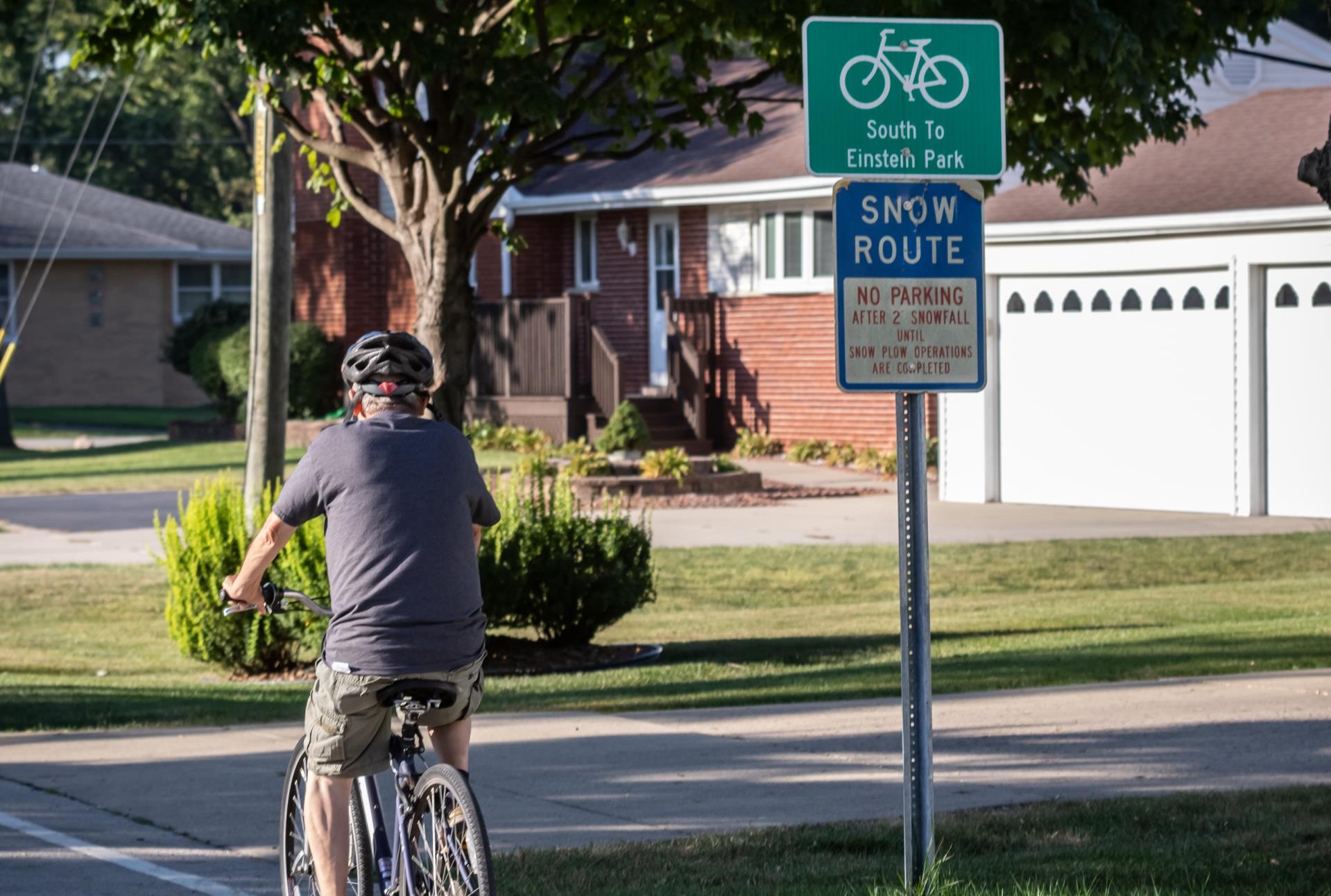 Man on bicycle wearing bike helmet